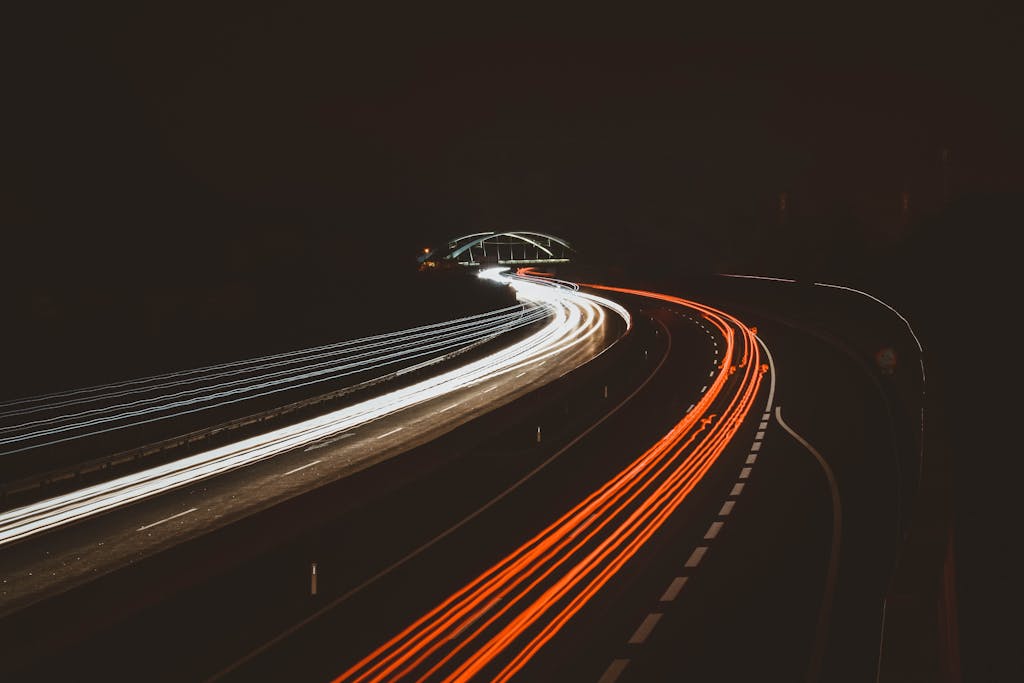 Long exposure of highway light trails captured at night in Mariatal, Tirol, Austria.